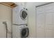 Laundry room with stacked washer and dryer, plus closet for storage at 10384 Se 41St Ter, Belleview, FL 34420