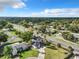 Aerial view of a residential area showcasing a home, lush greenery, and surrounding neighborhood at 1040 Waverly Dr, Longwood, FL 32750