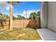 Fenced backyard featuring a lush green lawn and mature trees at 1040 Waverly Dr, Longwood, FL 32750