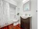 Bathroom featuring white walls, dark wood floors, a shower with white curtain, toilet, and dark wood vanity at 1040 Waverly Dr, Longwood, FL 32750