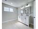 Bright bathroom featuring double vanity with sleek black faucets and modern lighting at 1040 Waverly Dr, Longwood, FL 32750