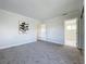 Spacious bedroom featuring gray carpet, neutral walls, and modern decor at 1040 Waverly Dr, Longwood, FL 32750