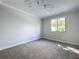 Bedroom featuring wall-to-wall carpet, neutral colored walls, and bright natural light at 1040 Waverly Dr, Longwood, FL 32750