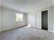 Bedroom featuring a window, light walls, and a closet with doors partially open at 1040 Waverly Dr, Longwood, FL 32750