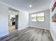 Dining area adjacent to kitchen featuring gray wood-look floors and natural light at 1040 Waverly Dr, Longwood, FL 32750