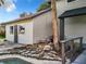 Exterior home detail with decorative rocks and pond leading up to the siding and garage door at 1040 Waverly Dr, Longwood, FL 32750