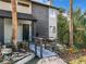 Exterior home with a water feature and landscaped front yard with a bridge leading to the front door at 1040 Waverly Dr, Longwood, FL 32750