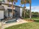 Close up of a landscaped front yard featuring a stone-lined pond with a small bridge walkway to the front door at 1040 Waverly Dr, Longwood, FL 32750