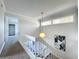 Upstairs hallway with carpet, a pendant light, and access to bedrooms at 1040 Waverly Dr, Longwood, FL 32750