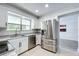 Bright kitchen featuring stainless steel appliances, granite countertops, and white cabinetry at 1040 Waverly Dr, Longwood, FL 32750