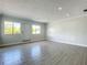 Bright living room with modern gray tile flooring and natural light at 1040 Waverly Dr, Longwood, FL 32750