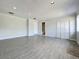 Bright living room with gray flooring, recessed lighting, and white trim at 1040 Waverly Dr, Longwood, FL 32750