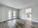 Living room featuring wood floors and sliding glass doors leading to an outdoor pool at 1040 Waverly Dr, Longwood, FL 32750