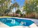 Sparkling pool surrounded by lush landscaping and a fenced backyard at 1040 Waverly Dr, Longwood, FL 32750