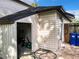 A single-story shed features vinyl siding and a black shingle roof in a well maintained backyard at 1040 Waverly Dr, Longwood, FL 32750