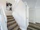 Carpeted stairs with a modern art piece hanging on the wall at 1040 Waverly Dr, Longwood, FL 32750