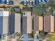 Birds-eye view of neighborhood with asphalt roof homes, parking lot, and an enclosed pool at 11136 Einbender Rd, Orlando, FL 32825