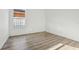 Clean, empty bedroom with modern flooring, neutral walls, and a bright window at 11136 Einbender Rd, Orlando, FL 32825