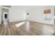 Bright, airy living room showcasing sleek flooring and two large windows that let in natural light at 11136 Einbender Rd, Orlando, FL 32825