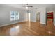 Primary bedroom with hardwood flooring, ceiling fan, and an ensuite bathroom at 112 Woden Way, Winter Haven, FL 33884