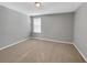 Neutral bedroom with carpeted flooring and a window with blinds at 11392 Sw 58Th Cir, Ocala, FL 34476