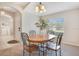 Bright dining area with a chandelier, a window, and an archway to another room at 114 Alexandria Cir, Deland, FL 32724