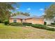 Charming single-story home featuring a well-manicured lawn and an attached two-car garage at 114 Alexandria Cir, Deland, FL 32724