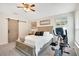 Cozy main bedroom displays a ceiling fan, neutral paint, and plush carpet at 114 Alexandria Cir, Deland, FL 32724