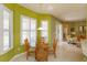 Bright dining area featuring a glass table set and white shuttered windows at 11554 Blackmoor Dr, Orlando, FL 32837