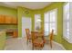 Bright dining area featuring a glass table set and white shuttered windows at 11554 Blackmoor Dr, Orlando, FL 32837