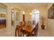 Well-lit dining room with large table and chairs, complemented by elegant decor and natural light at 11554 Blackmoor Dr, Orlando, FL 32837