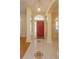 Bright foyer with decorative tiled flooring and a glimpse of the adjacent hardwood flooring at 11554 Blackmoor Dr, Orlando, FL 32837