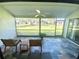 Screened-in porch with slate floors and beautiful backyard view at 1200 Winterberry Lane, Fern Park, FL 32730