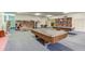 This recreation room features a pool table, ping pong table, library, and various seating arrangements at 1200 Winterberry Lane, Fern Park, FL 32730