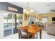 Bright dining area with a view of the screened pool, adjacent to the living room at 1243 Osprey Way, Apopka, FL 32712