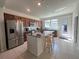 Well-equipped kitchen featuring stainless steel appliances and a granite-topped island at 14388 Orchild Island Dr, Orlando, FL 32827