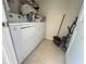 Convenient laundry room equipped with a washer and dryer at 14388 Orchild Island Dr, Orlando, FL 32827