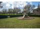 Neighborhood playground with a slide and climbing structure on a grassy lot at 15574 Murcott Blossom Blvd, Winter Garden, FL 34787