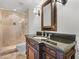 Stylish bathroom showcasing a tiled shower, vanity with dark countertop, and elegant fixtures at 1690 Oneco Ave, Winter Park, FL 32789