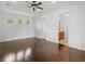 Bedroom with wood floors and an ensuite bathroom at 1690 Oneco Ave, Winter Park, FL 32789