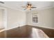 Bedroom with hardwood flooring, neutral paint, a ceiling fan, and lots of natural light at 1690 Oneco Ave, Winter Park, FL 32789