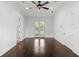Bedroom with wood floors and french doors leading to back yard at 1690 Oneco Ave, Winter Park, FL 32789