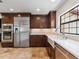 Kitchen with stainless appliances, custom cabinets, and white apron sink at 1690 Oneco Ave, Winter Park, FL 32789