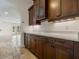 Kitchen area with custom cabinets and drawers with white counter tops at 1690 Oneco Ave, Winter Park, FL 32789