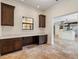 Office area with custom wood cabinets and travertine flooring at 1690 Oneco Ave, Winter Park, FL 32789