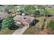 Aerial view of home and the surrounding neighborhood with mature trees and landscaping at 17445 Hillside Dr, Montverde, FL 34756