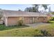 View of the backyard featuring a patio, green grass and the back of the home at 17445 Hillside Dr, Montverde, FL 34756