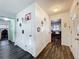 Hallway leading to the kitchen and office area, featuring hardwood floors and neutral decor at 1816 Jasper Drive, Orlando, FL 32807