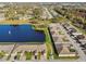 Aerial view of homes, lake and mature trees in a well-planned residential community at 1821 Christina Lee Ln, St Cloud, FL 34769