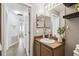 Bathroom featuring a wood vanity and mirror at 1821 Christina Lee Ln, St Cloud, FL 34769